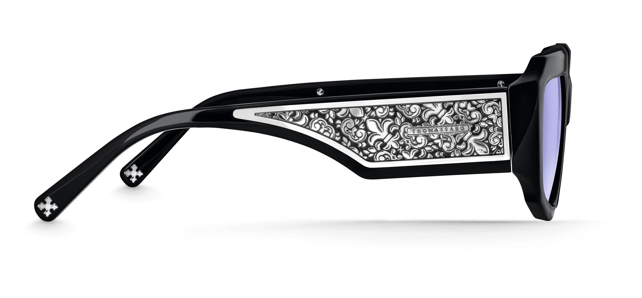 Close-up of the engraved silver detailing on a sunglasses temple